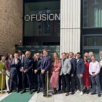 people cutting a ribbon