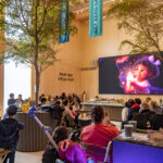 people watching a movie on a big screen
