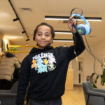 boy holding headphones
