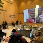 people listening to a speaker