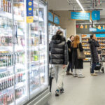 people at an aisle of a shop