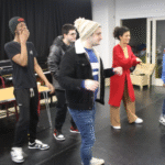 group of people performing on a stage