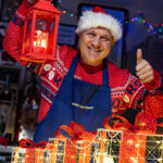 a man holding a lantern