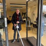 a woman holding a vacuum