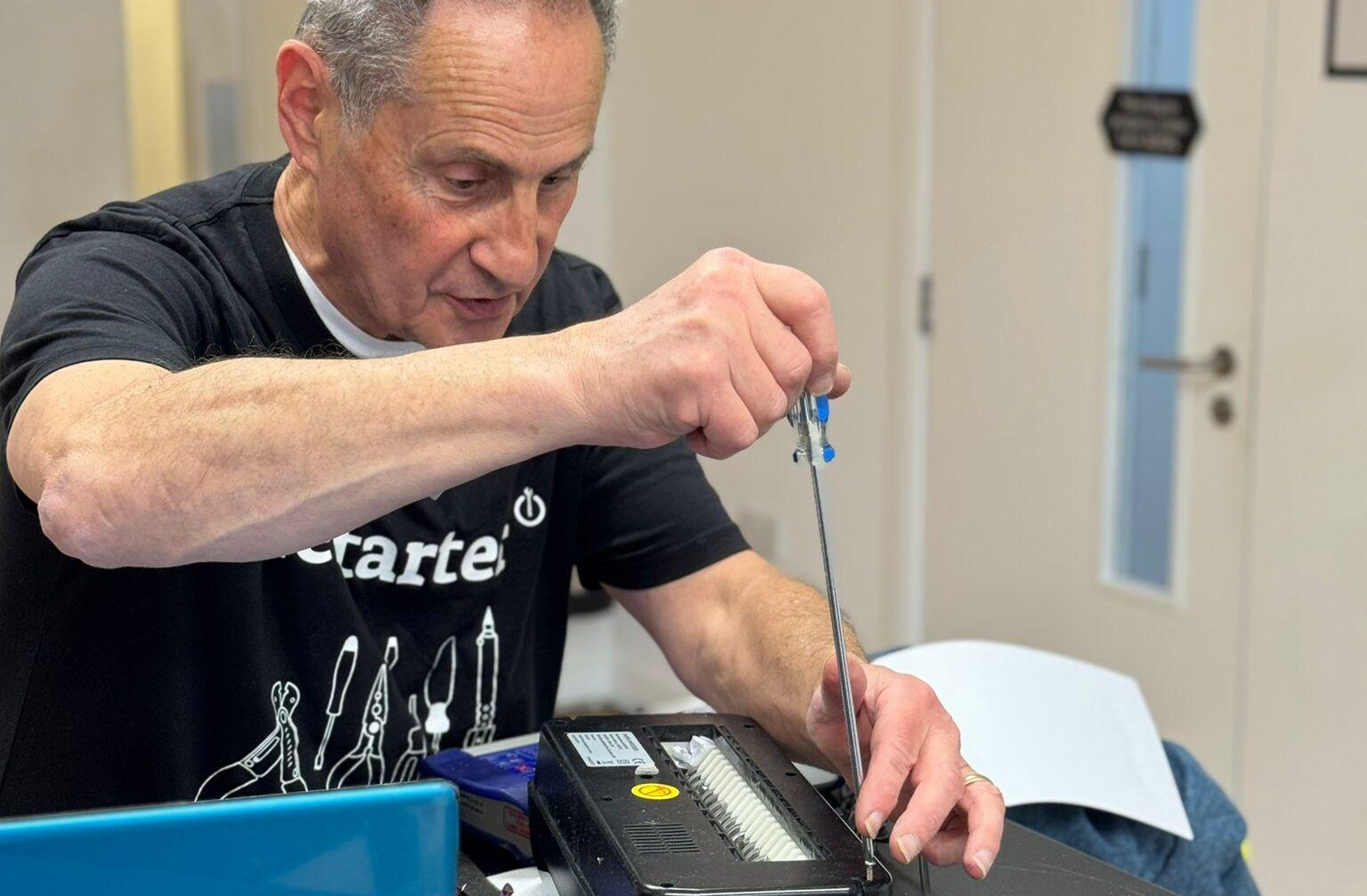 man fixing a machine