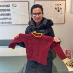 woman holding a jumper