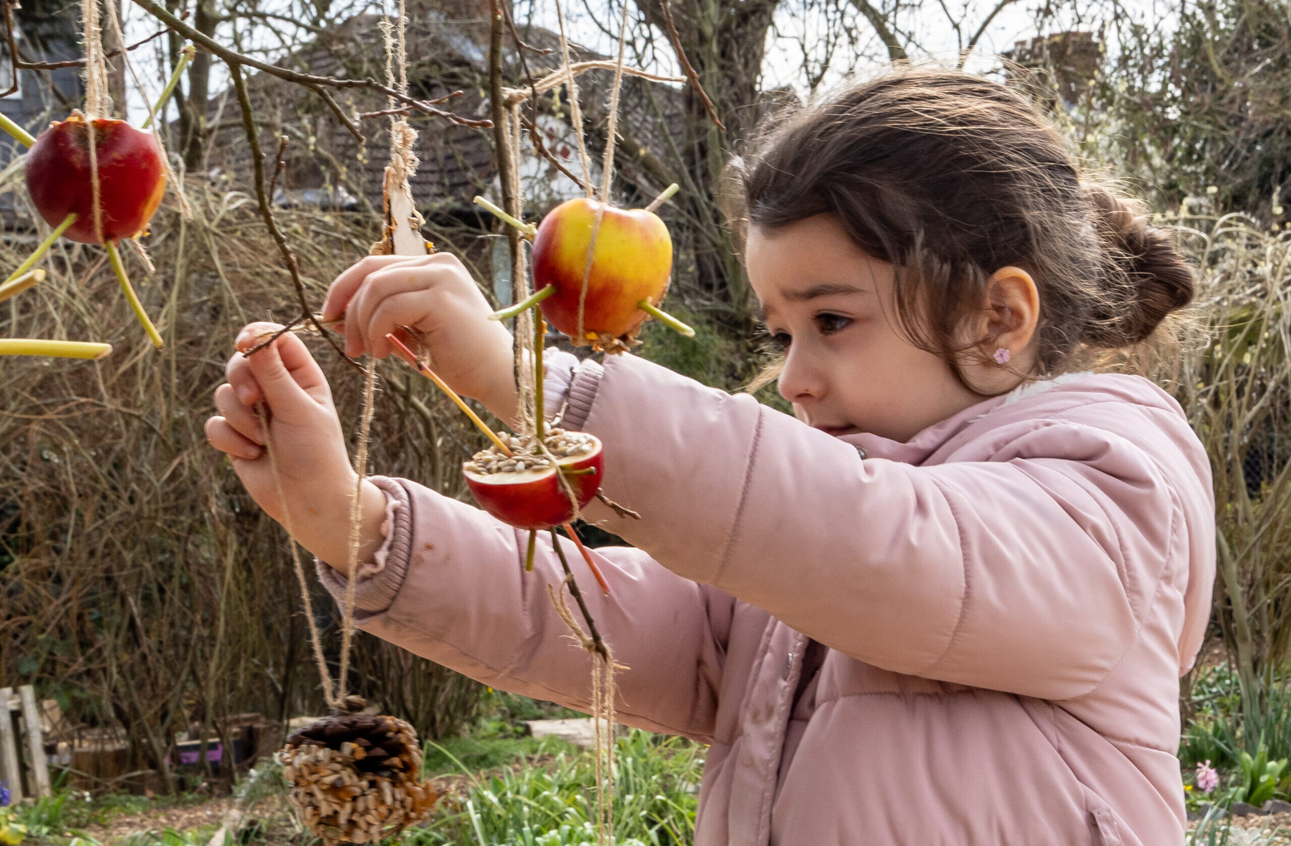 girl holding plant