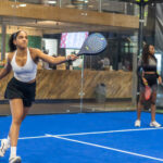 woman holding a tennis racket
