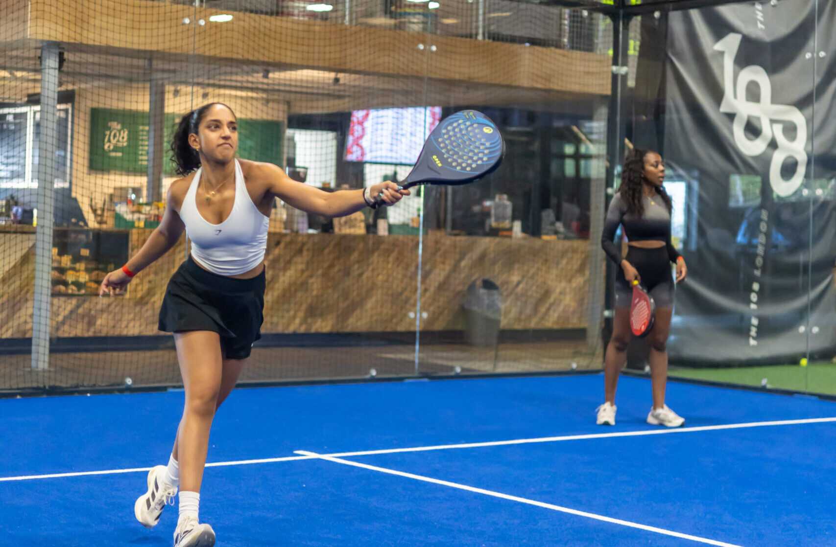 woman holding a tennis racket