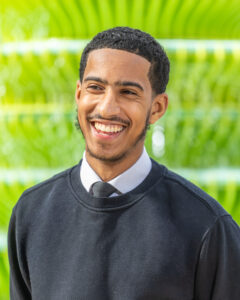 a boy smiling at the photo